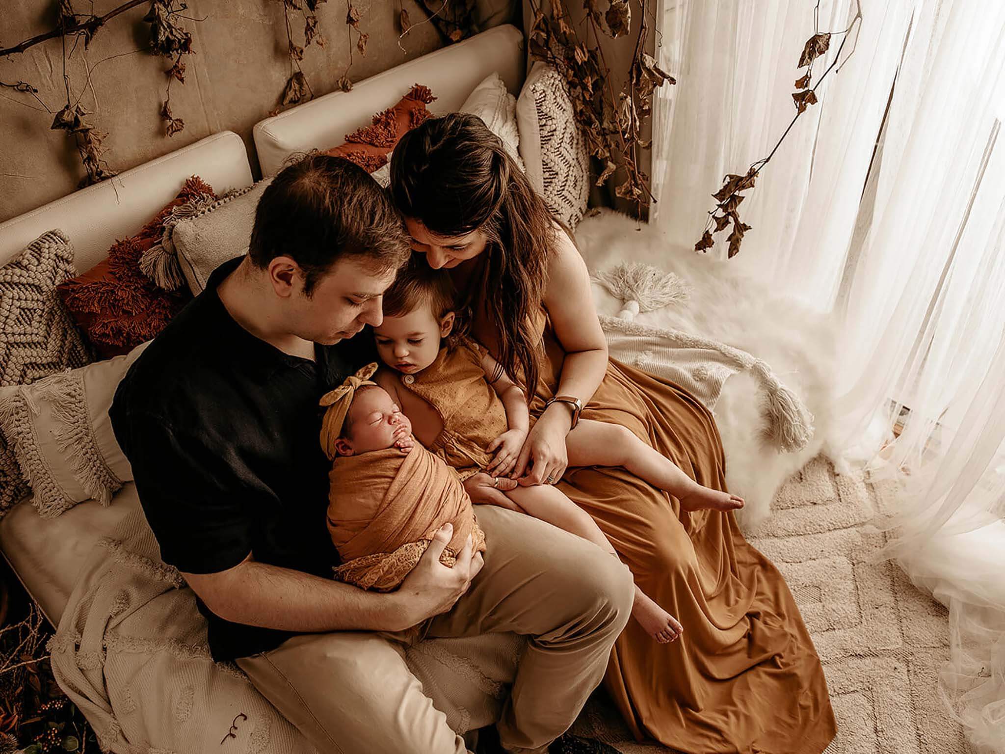 Family holding their babies in their arm Lifetime Stories Photography Victoria Burcusel