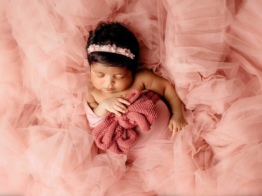 newborn baby girl in pink tulle 