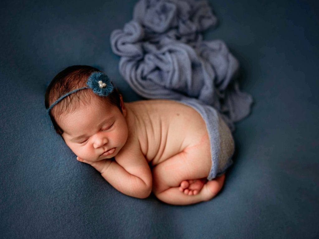 newborn baby girl posed by the best brisbane newborn photographer in the bum up pose 